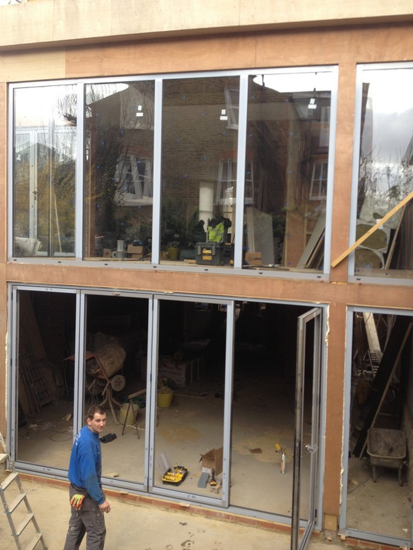 Aluminium bi-fold doors with two-storey glazing in Holborn