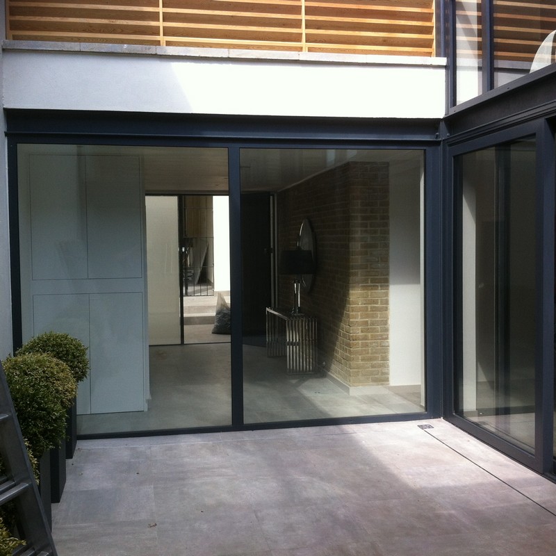 Floor-to-ceiling sliding doors opening to courtyard in Holborn