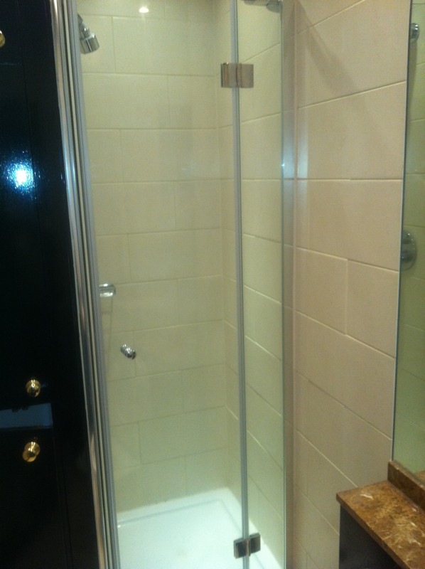 Frameless glass shower enclosure with chrome fittings in Holborn