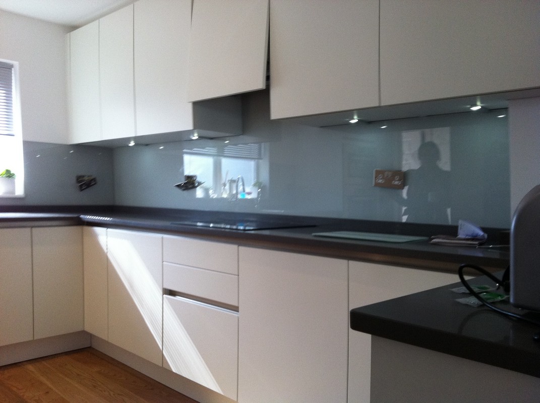 Grey glass kitchen splashback with LED lighting in Holborn